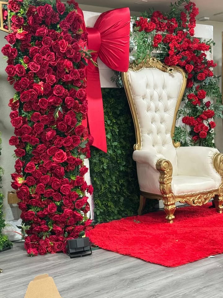 Rose wall and throne chair setup at The Destiny Venue